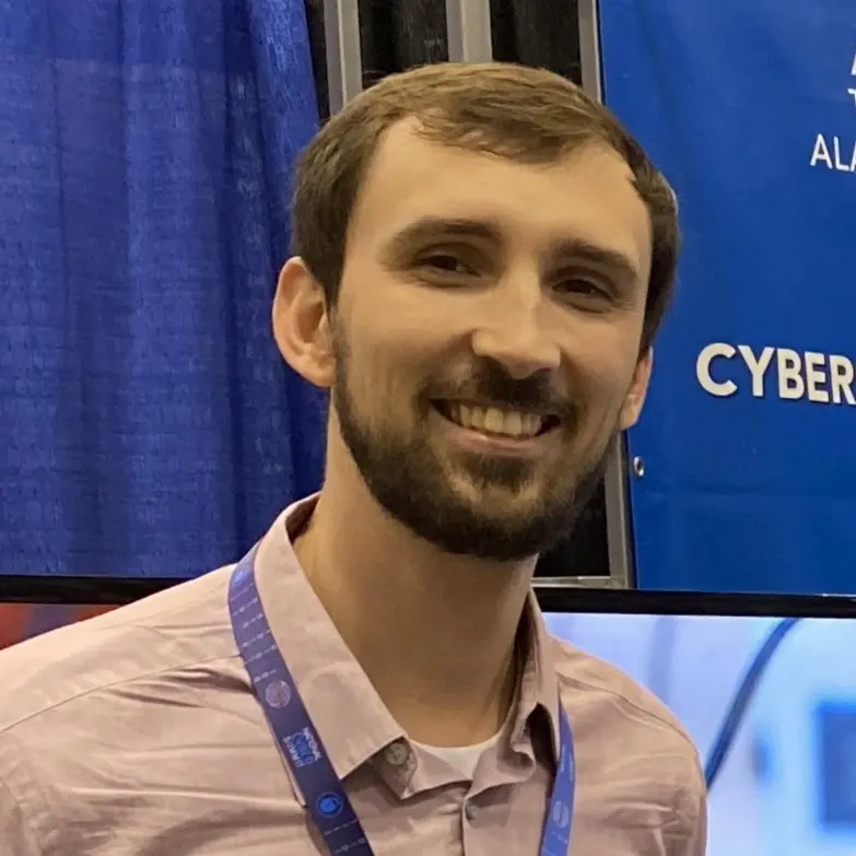 Bryon Miller smiling at a cybersecurity conference